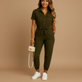 woman wearing button front tailored jumpsuit with slim silhouette shown in full front view outfit