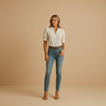 woman wearing classic white button blouse with lightly tailored fit shown in full front view outfit