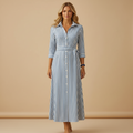 woman wearing long summer dress with flowing silhouette shown in full front view outfit
