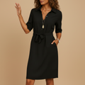 woman wearing modern midi dress with elegant silhouette shown in full front view outfit