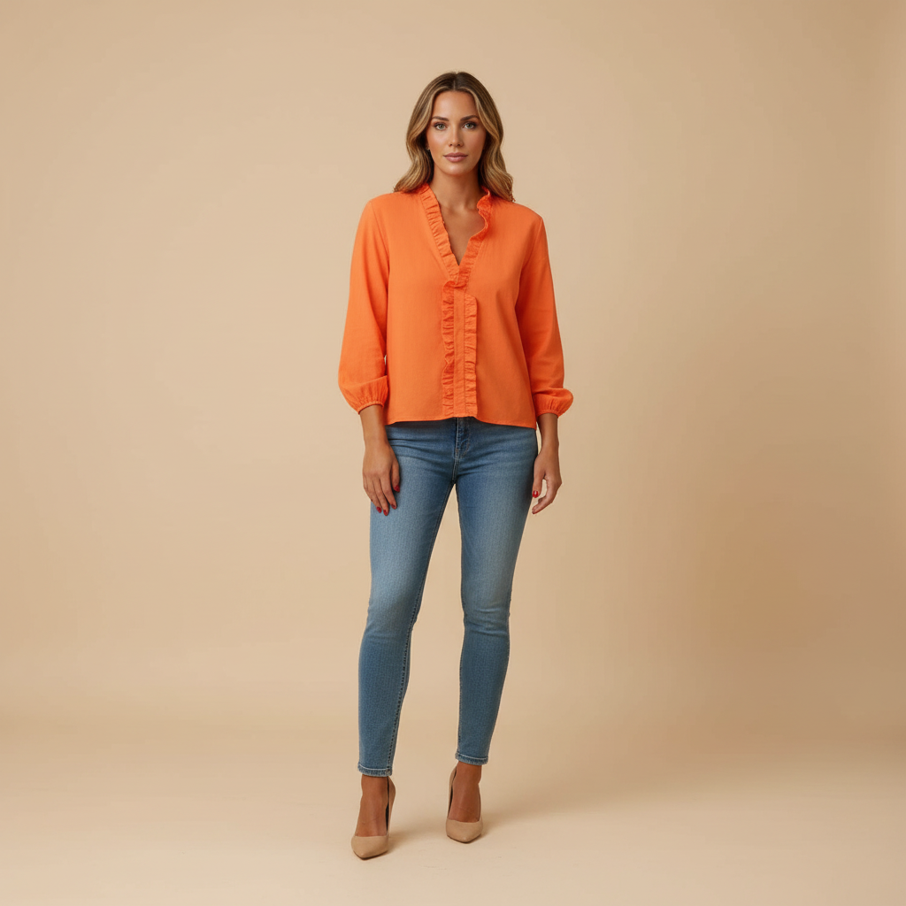 woman wearing ruffle detail blouse with lightweight structure shown in full front view outfit
