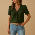 woman wearing V neck lace detail blouse with lightweight structure shown in full front view outfit
