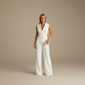 woman wearing wide leg wrap jumpsuit with tailored silhouette shown in full front view outfit